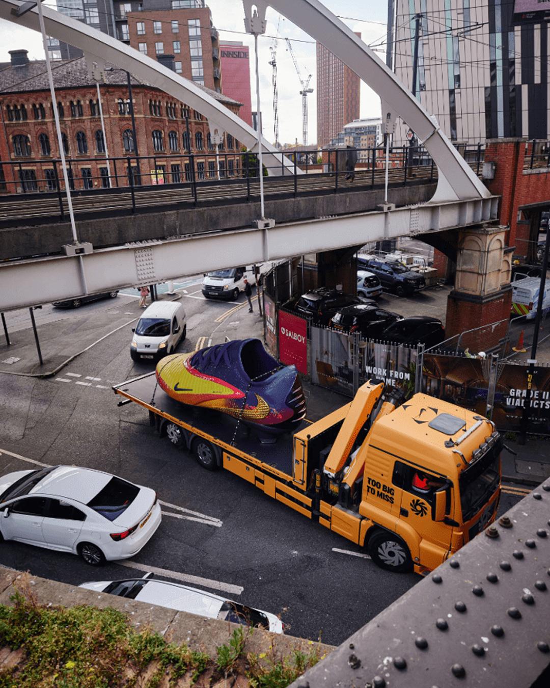 Erling's boot is driving around Manchester city on the back of a British lorry.