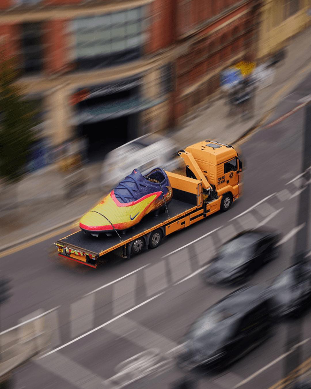 Erling's boot is driving around Manchester city on the back of a British lorry.