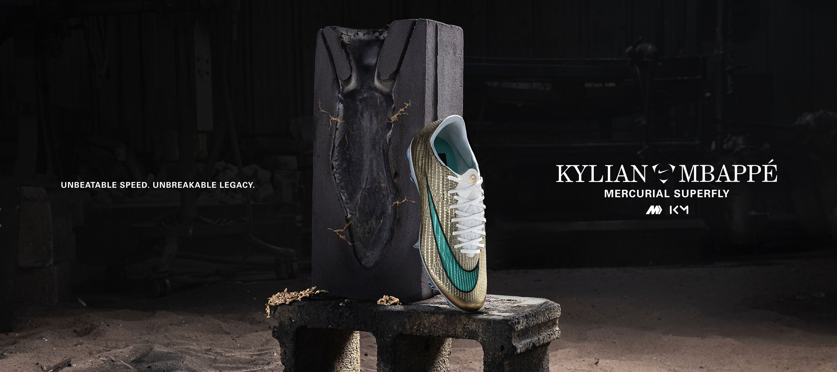 Kylian's golden football boot leaning against a mold with gold cracks.