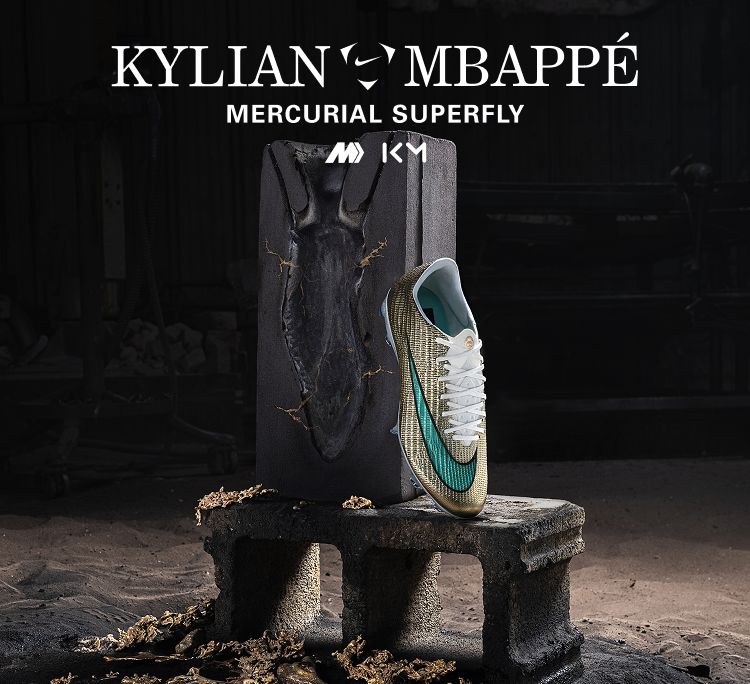 Kylian's golden football boot leaning against a mold with gold cracks.