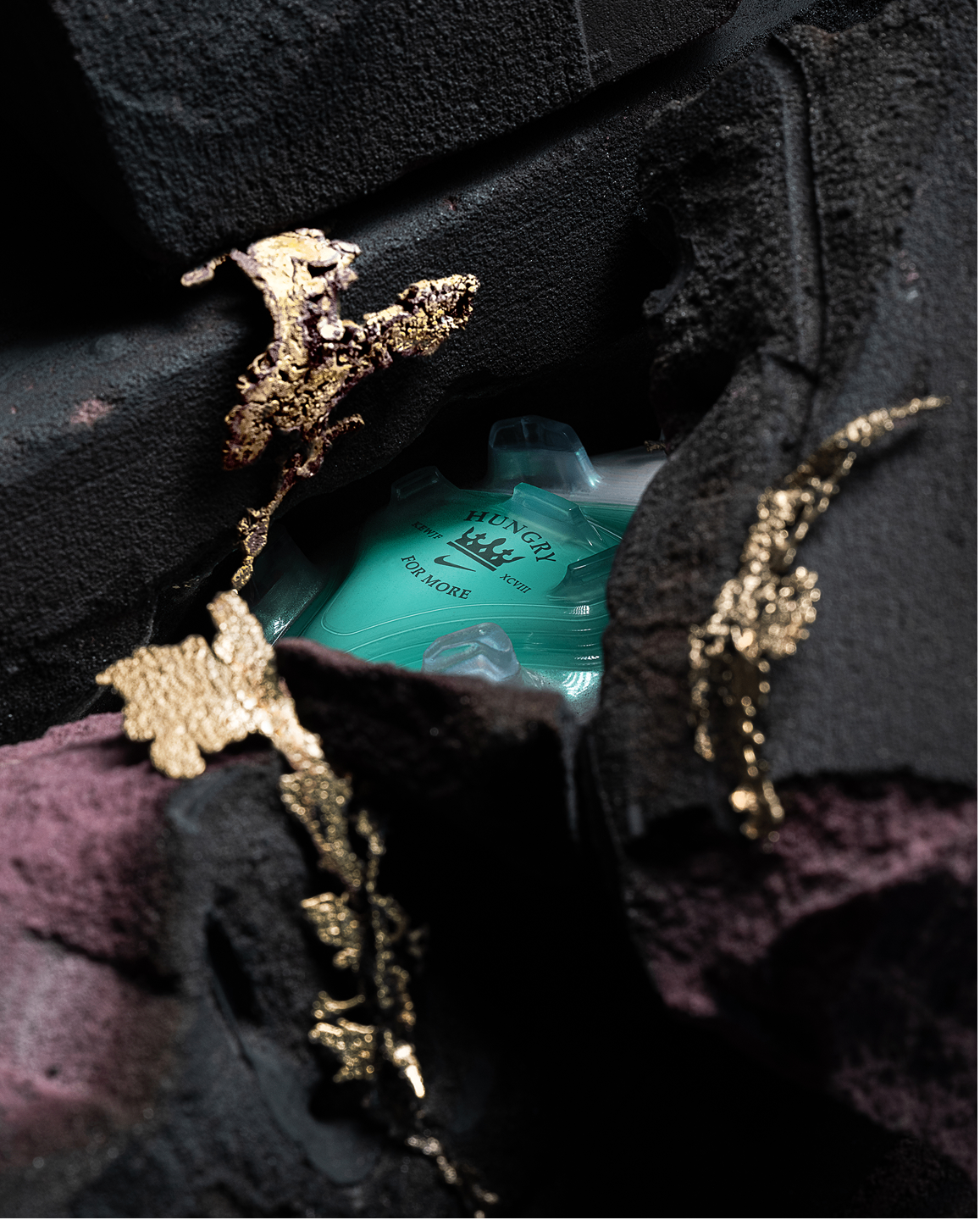 Graphics on the bottom of Kylian's boot is revealed through the dark stoned mold.