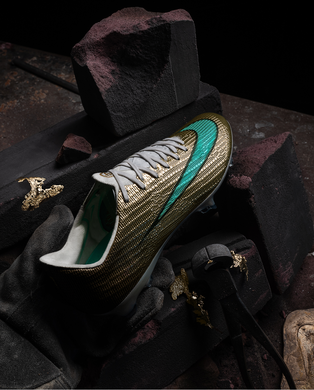 A main pours molten metal into a boot mold in a foundry environment.